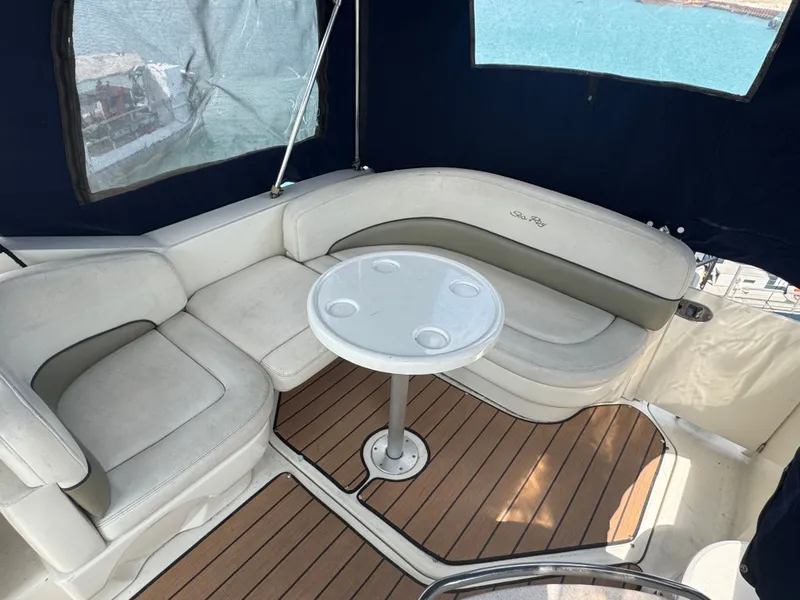Slide: The Image of Interior of a 2005 Sea Ray Sundancer 260 with seating area and table. - 8