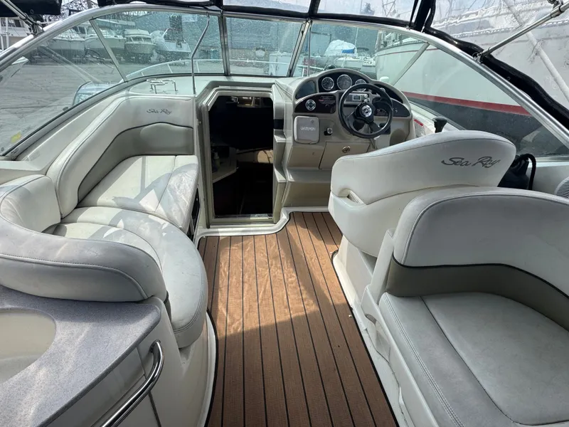 Slide: The Image of Interior of a 2005 Sea Ray Sundancer 260 with white seating. - 9