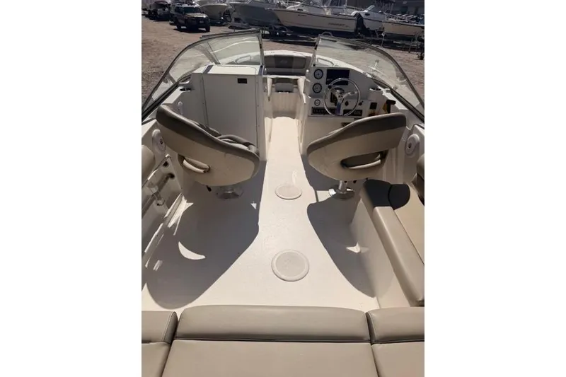 Slide: The Image of 2021 Key West 203 DFS boat interior with dual seats and steering console. - 12