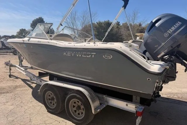 Slide: The Image of 2021 Key West 203 DFS boat on trailer with Yamaha engine, parked outdoors. - 3