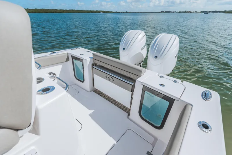 Slide: The Image of 2026 Sportsman Open 262 Center Console boat with dual engines on calm water. - 3