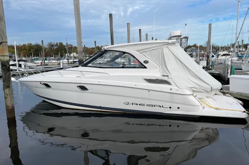 Slide: The Image of 2012 Regal 35 Sport Coupe yacht docked at marina, side view. - 14