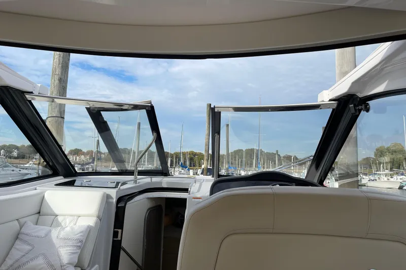Slide: The Image of Interior view of a 2012 Regal 35 Sport Coupe yacht at a marina. - 18
