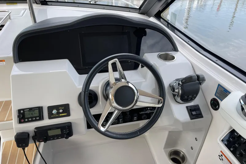 Slide: The Image of Cockpit of 2012 Regal 35 Sport Coupe with steering wheel and control panel. - 22