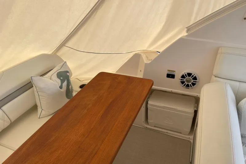 Slide: The Image of Interior of 2012 Regal 35 Sport Coupe with wooden table and white seating. - 28