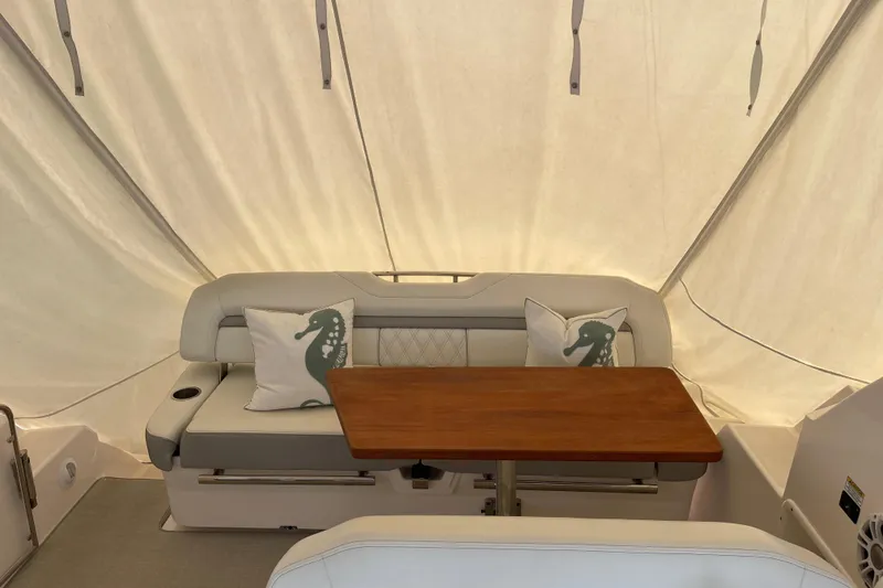 Slide: The Image of Interior of 2012 Regal 35 Sport Coupe with seating and wooden table. - 30