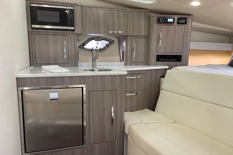 Slide: The Image of Interior of 2012 Regal 35 Sport Coupe with kitchenette and seating area. - 33