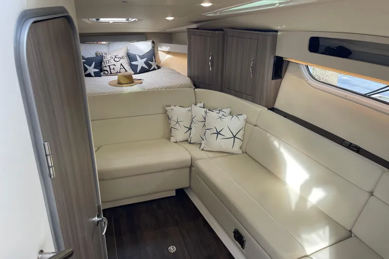 Slide: The Image of Luxurious interior of a 2012 Regal 35 Sport Coupe with cozy seating and stylish decor. - 36