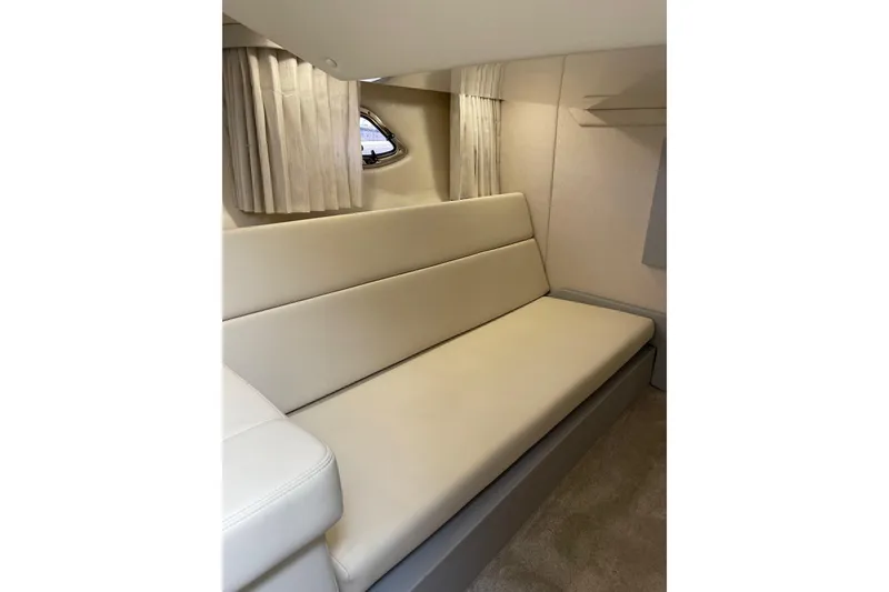 Slide: The Image of Interior of 2012 Regal 35 Sport Coupe with beige seating and curtains. - 40