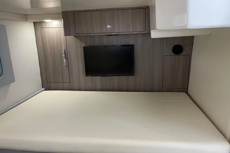 Slide: The Image of Interior cabin of a 2012 Regal 35 Sport Coupe with bed and wall-mounted TV. - 41
