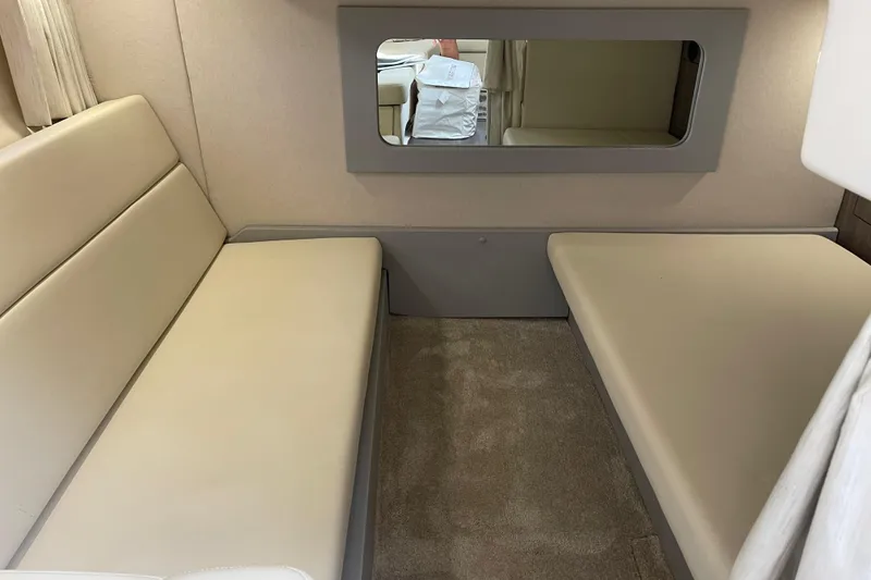 Slide: The Image of Interior cabin of a 2012 Regal 35 Sport Coupe with beige seating and carpet. - 42