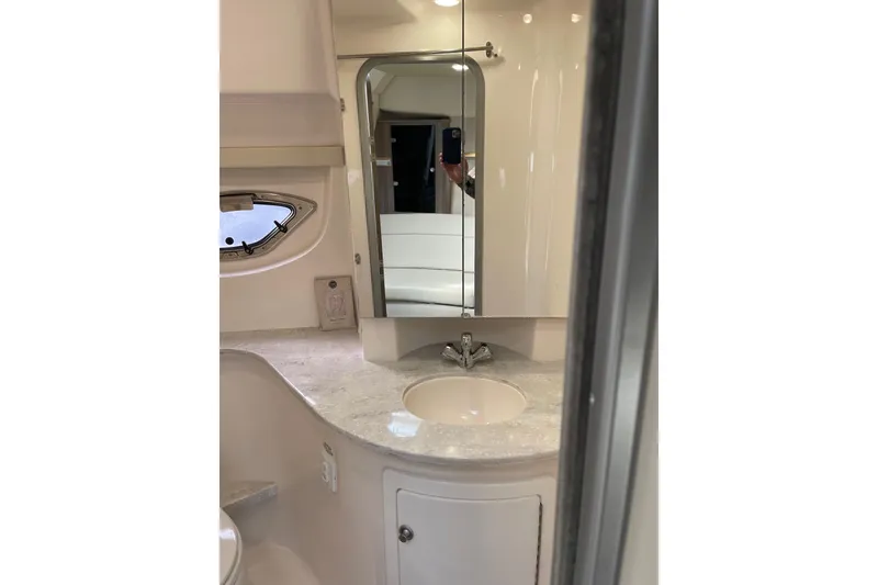 Slide: The Image of Bathroom interior of 2012 Regal 35 Sport Coupe with mirror and sink. - 43