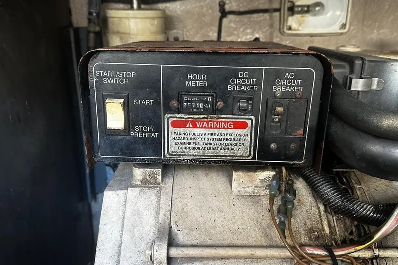 Slide: The Image of Control panel of a 2004 Sea Ray 380 Sundancer with start switch and circuit breakers. - 21