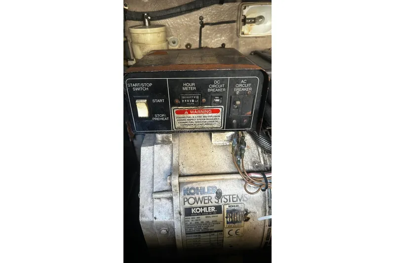 Slide: The Image of Kohler power system control panel on a 2004 Sea Ray 380 Sundancer boat. - 22