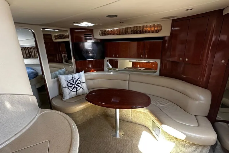 Slide: The Image of Luxurious interior of 2004 Sea Ray 380 Sundancer yacht with elegant seating and wooden finishes. - 7