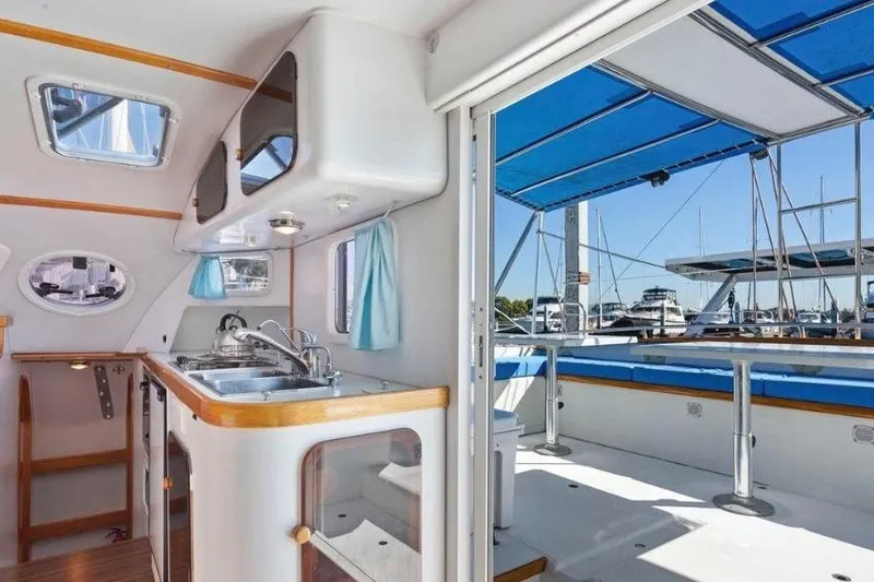 Slide: The Image of Interior view of 2002 Outremer 55 Light yacht, featuring kitchen and deck area. - 12