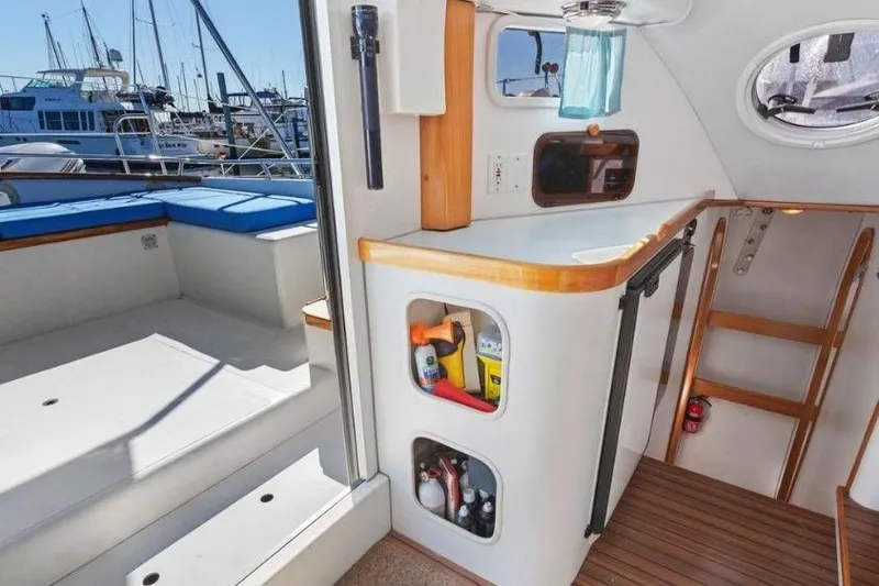 Slide: The Image of Interior of 2002 Outremer 55 Light yacht with storage and seating area. - 15