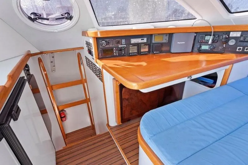 Slide: The Image of Interior of 2002 Outremer 55 Light yacht with navigation equipment and wooden finishes. - 24