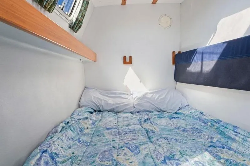 Slide: The Image of Cozy cabin bed in 2002 Outremer 55 Light yacht with patterned bedding. - 32