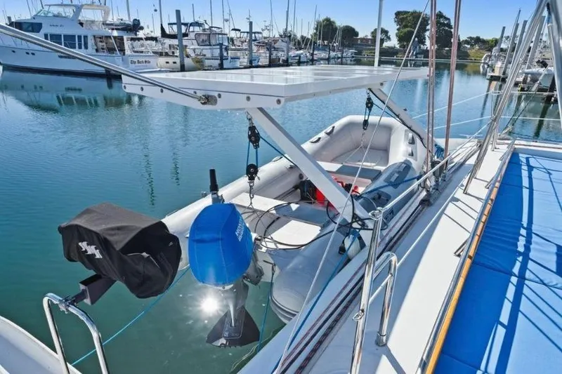 Slide: The Image of Outremer 55 Light 2002 yacht with dinghy and solar panel in marina. - 6