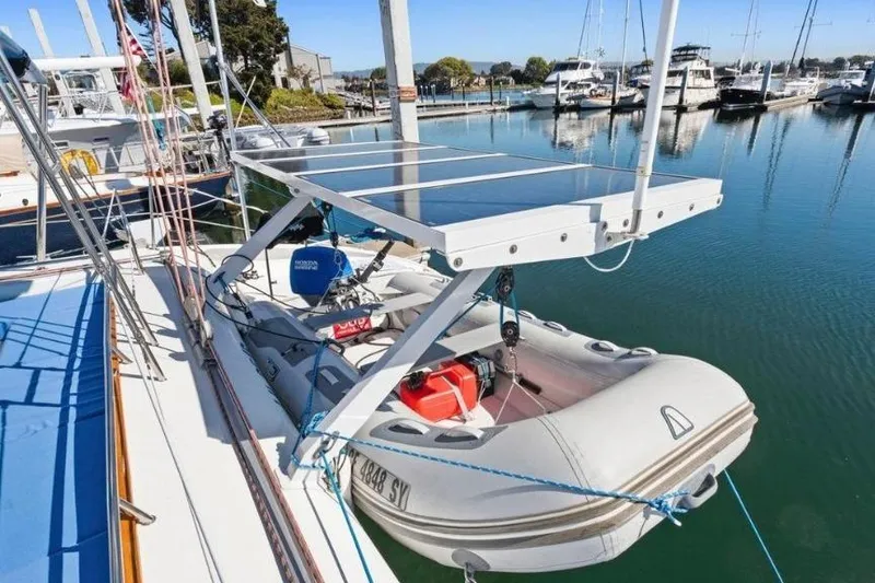 Slide: The Image of Outremer 55 Light 2002 yacht with solar panels and dinghy at marina. - 7