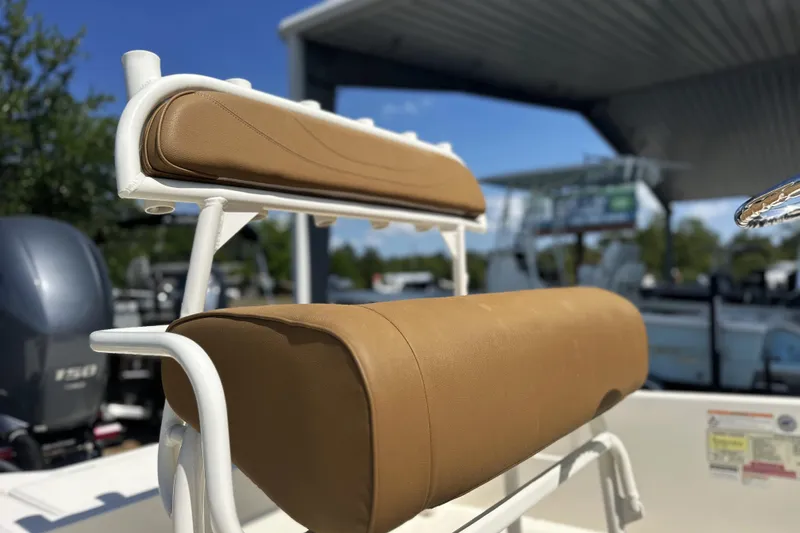 Slide: The Image of 2023 Skeeter SX210 boat seat with tan upholstery under a canopy. - 6