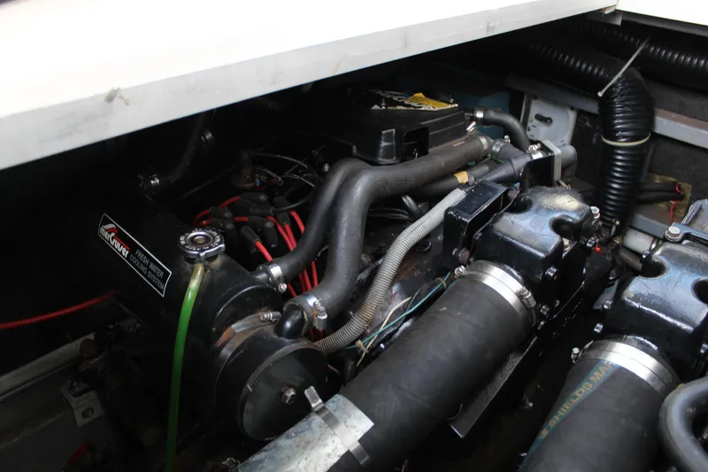Slide: The Image of Engine compartment of a 1986 Searay 340 Express boat, featuring a MerCruiser cooling system. - 7