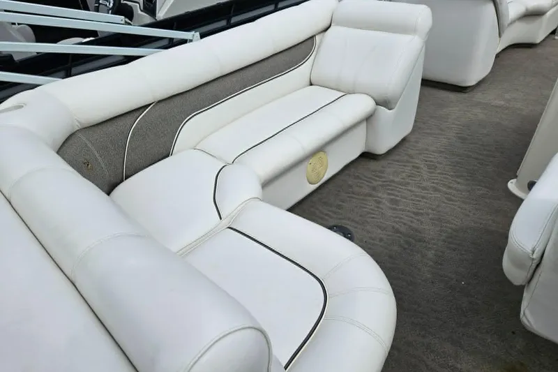 Slide: The Image of Luxurious white seating on 2007 Premier 225 Legend RE boat interior. - 13
