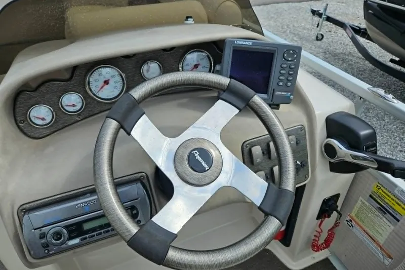 Slide: The Image of Steering console of 2007 Premier 225 Legend RE boat with gauges and navigation system. - 3