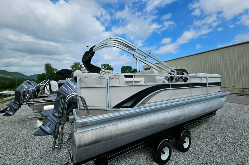 Slide: The Image of 2007 Premier 225 Legend RE pontoon boat on trailer, featuring Yamaha outboard motors. - 9