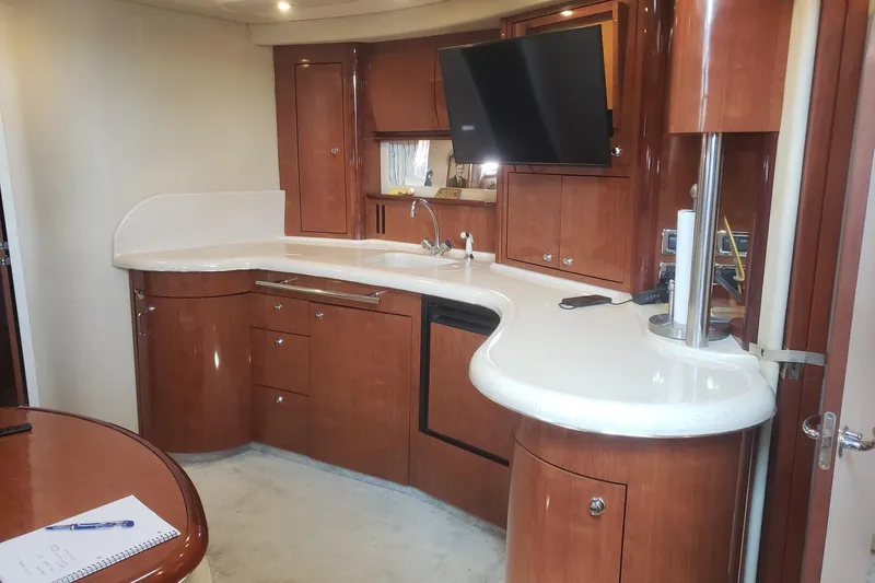 Slide: The Image of Luxurious 2003 Sea Ray 420 Sundancer yacht interior with modern kitchen amenities. - 14