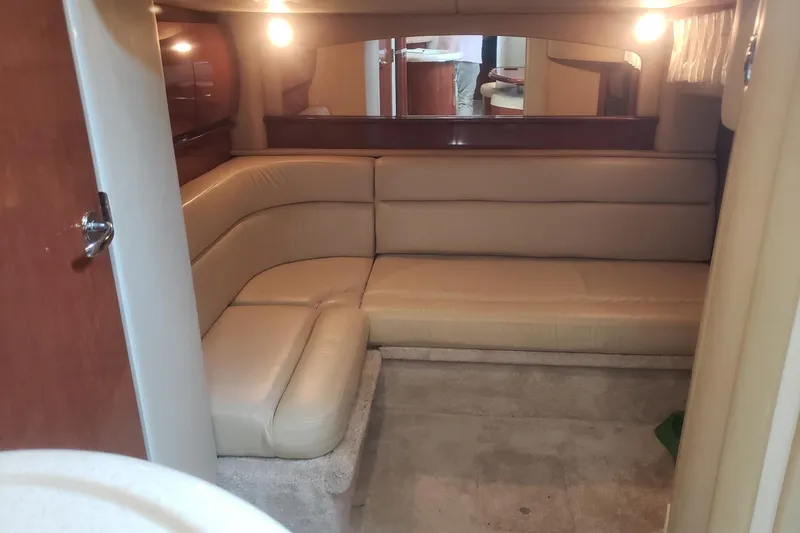 Slide: The Image of Interior of a 2003 Sea Ray 420 Sundancer yacht with beige sofa. - 21