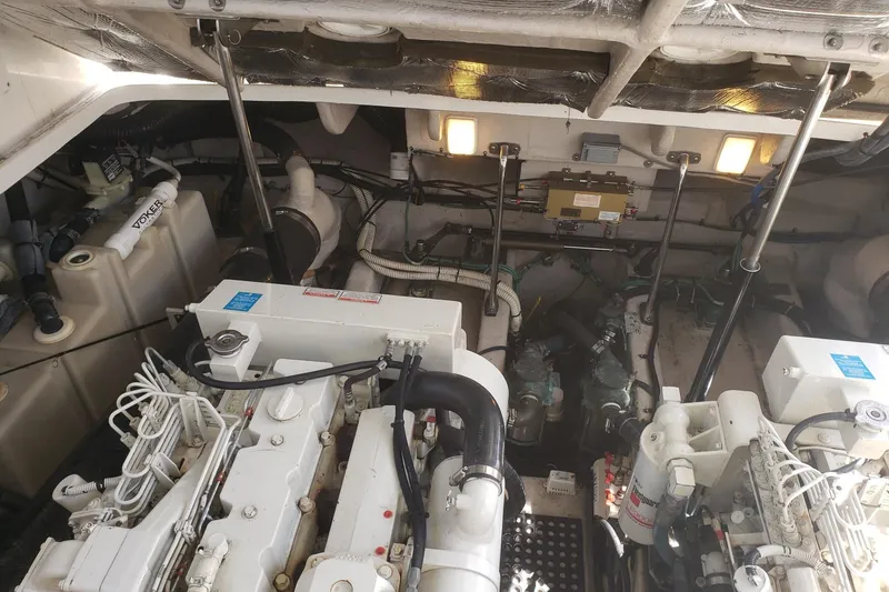 Slide: The Image of Engine room of a 2003 Sea Ray 420 Sundancer yacht, showcasing mechanical components. - 28