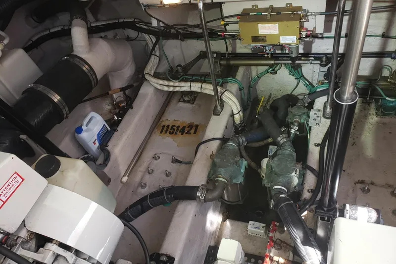 Slide: The Image of Engine room of a 2003 Sea Ray 420 Sundancer with visible components and wiring. - 29