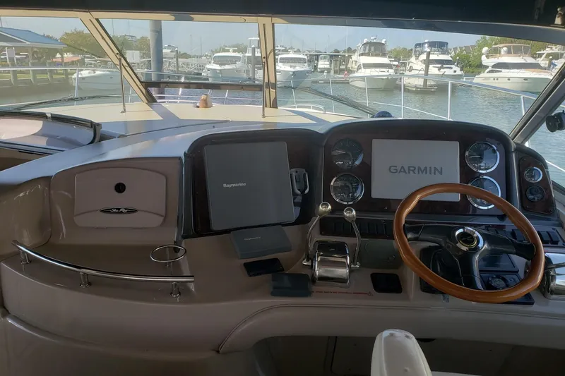 Slide: The Image of Helm of 2003 Sea Ray 420 Sundancer with Garmin navigation system, docked at marina. - 7