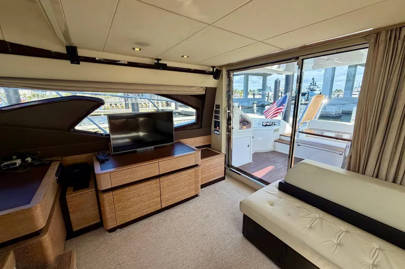 Slide: The Image of Luxurious interior of 2013 Azimut 60 yacht with TV and outdoor deck view. - 26