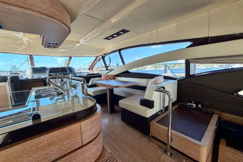 Slide: The Image of Luxurious interior of a 2013 Azimut 60 yacht with elegant seating and panoramic windows. - 27
