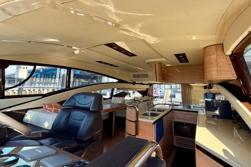 Slide: The Image of Luxurious interior of a 2013 Azimut 60 yacht featuring modern kitchen and seating area. - 32