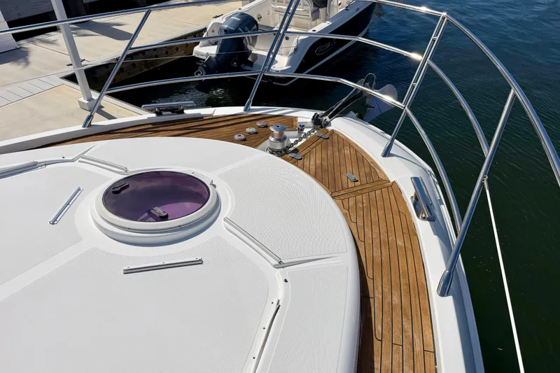 Slide: The Image of Bow of 2013 Azimut 60 yacht with teak decking and hatch, docked at marina. - 37