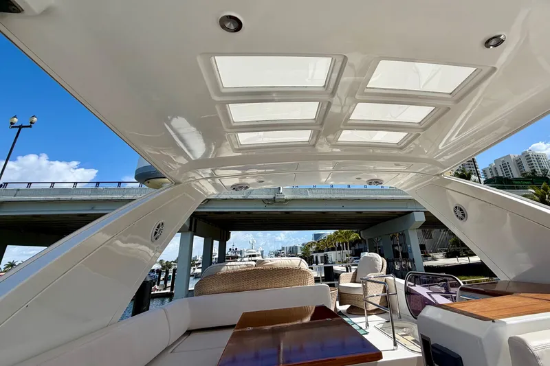 Slide: The Image of Luxurious 2013 Azimut 60 yacht interior with skylight, docked under a bridge on a sunny day. - 41