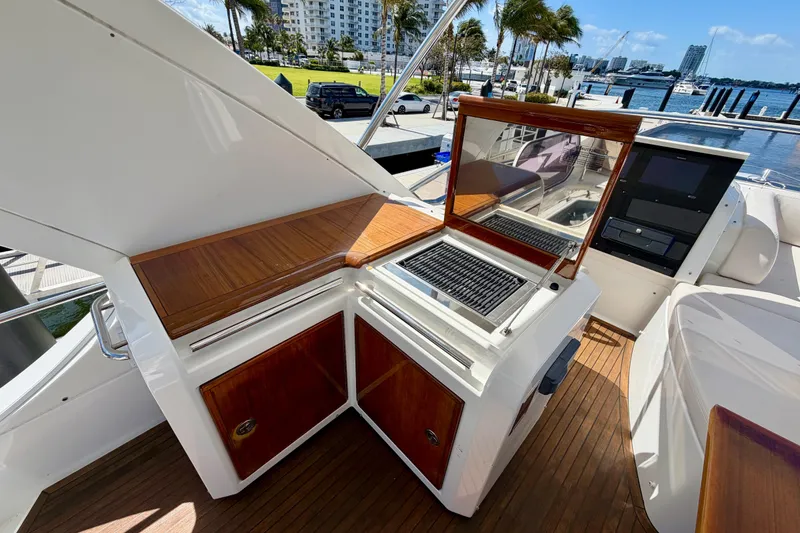 Slide: The Image of Outdoor kitchen on 2013 Azimut 60 yacht with grill and wooden cabinetry. - 42