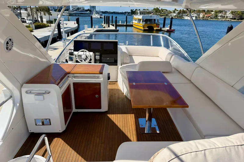 Slide: The Image of Luxurious 2013 Azimut 60 yacht interior with elegant seating and wooden table. - 43