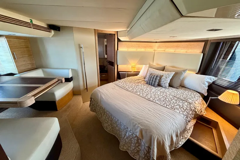 Slide: The Image of Luxurious bedroom interior of a 2013 Azimut 60 yacht, featuring elegant bedding and modern design. - 47