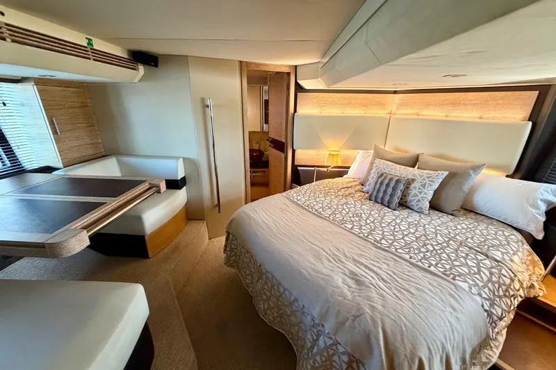 Slide: The Image of Luxurious bedroom interior of 2013 Azimut 60 yacht with elegant bedding and seating area. - 49