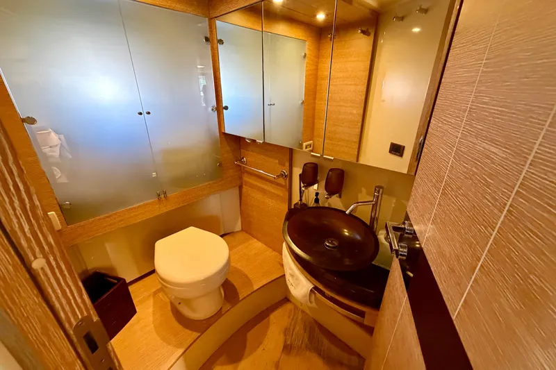 Slide: The Image of Luxurious bathroom on 2013 Azimut 60 yacht with modern fixtures and elegant wood finishes. - 50