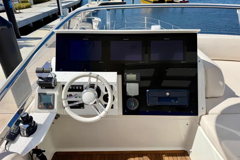 Slide: The Image of Helm of 2013 Azimut 60 yacht with modern navigation equipment and steering wheel. - 57