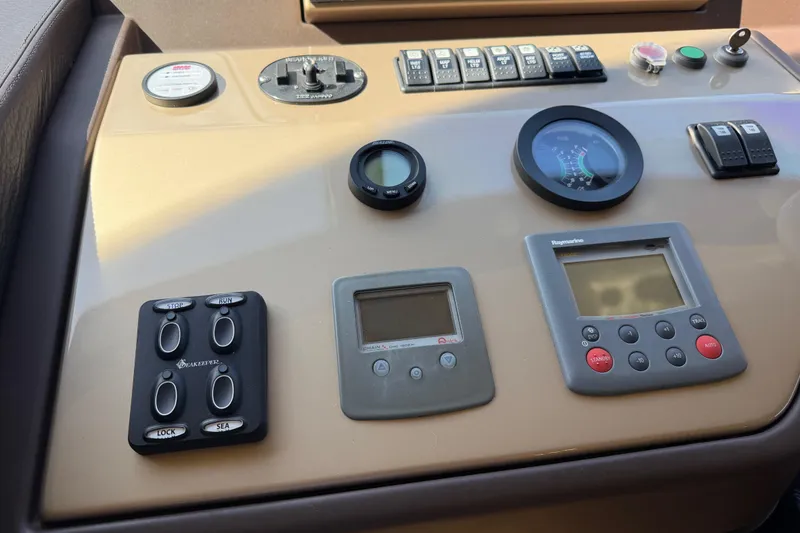 Slide: The Image of Control panel of a 2013 Azimut 60 yacht with various gauges and switches. - 59