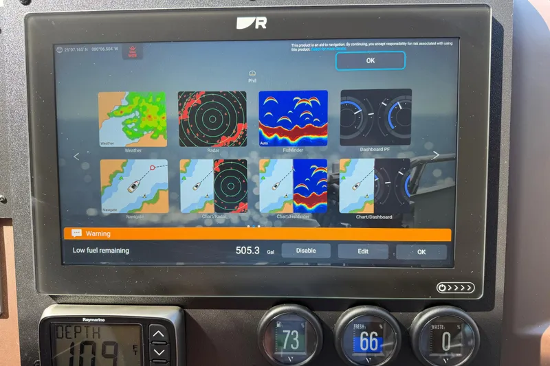 Slide: The Image of Boat navigation system displaying weather, radar, and low fuel warning on Azimut 60, 2013 model. - 60