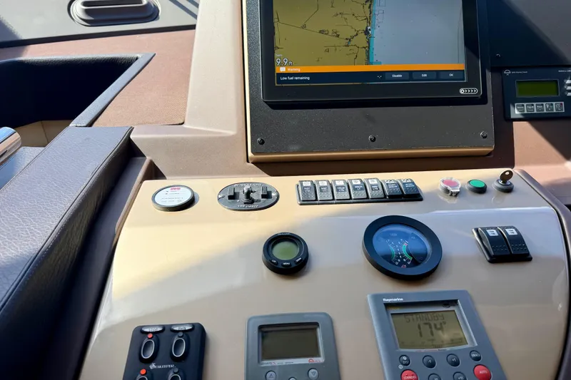 Slide: The Image of Control panel of a 2013 Azimut 60 yacht with navigation and monitoring systems. - 61