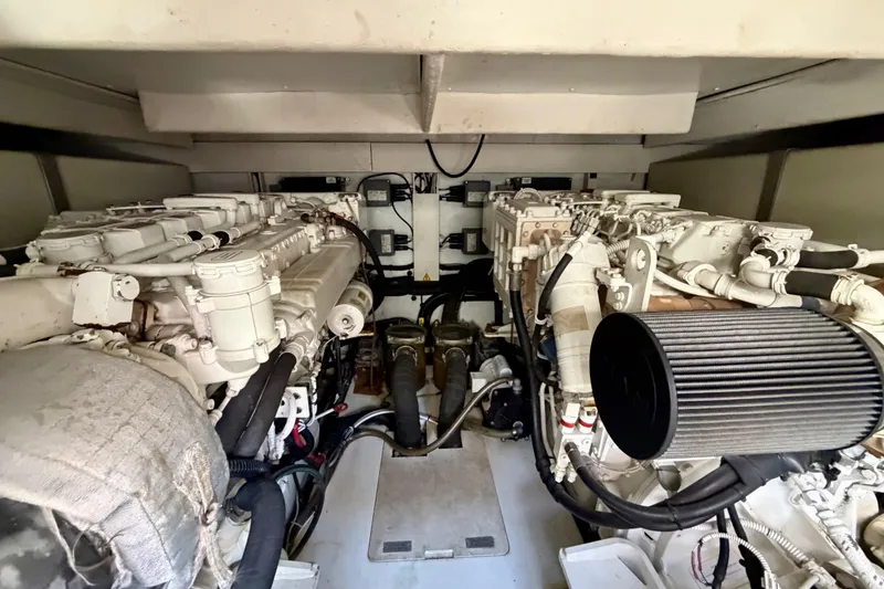 Slide: The Image of Engine room of a 2013 Azimut 60 yacht, showcasing dual engines and mechanical components. - 66